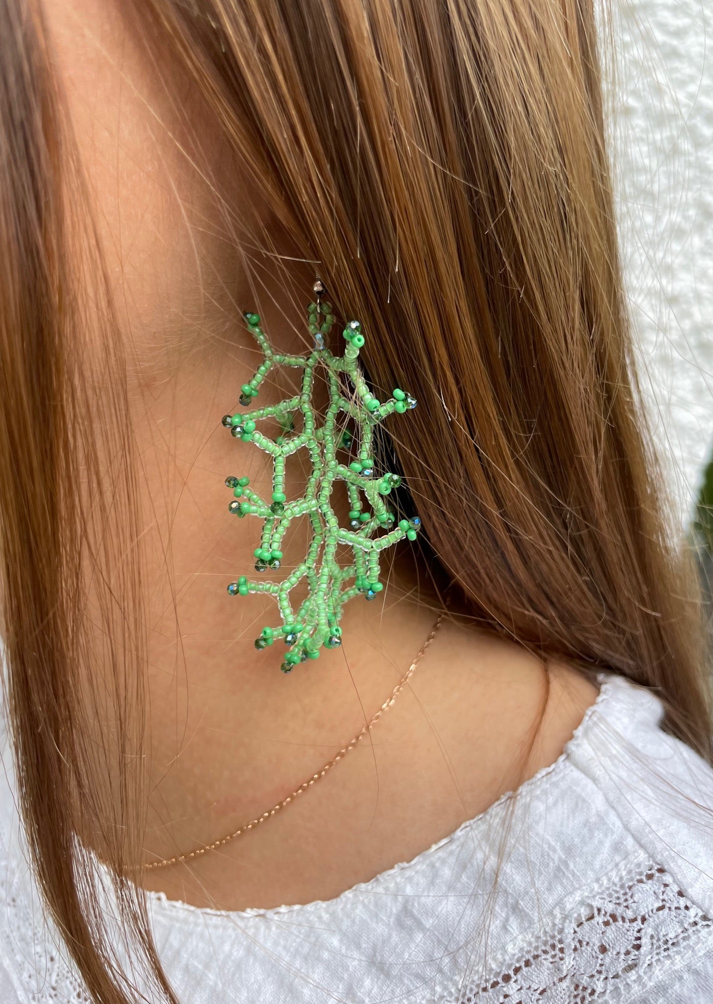 Glossy light green lined crystal