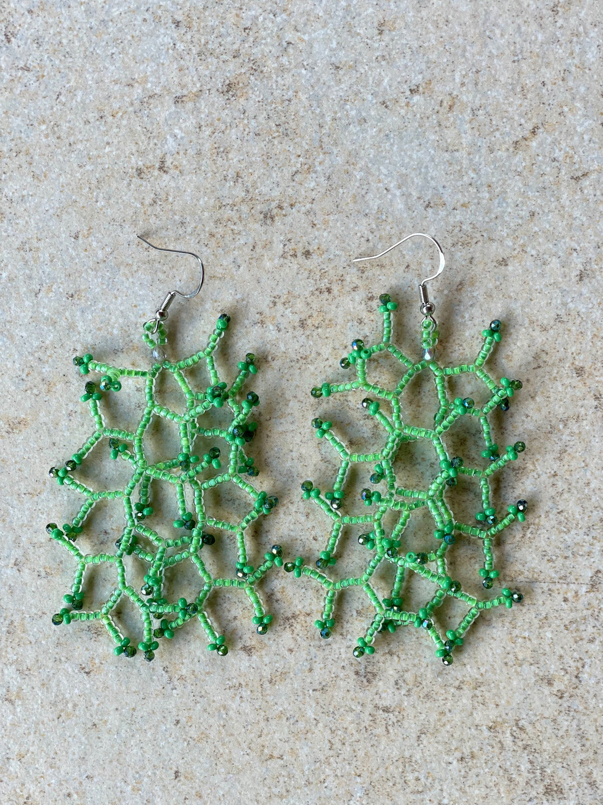 Glossy light green lined crystal
