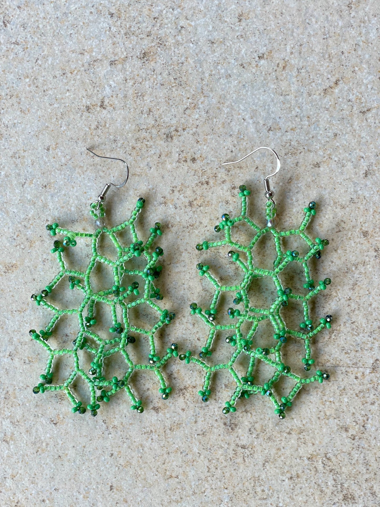 Glossy light green lined crystal