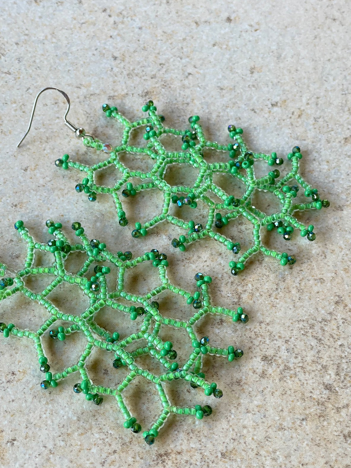 Glossy light green lined crystal