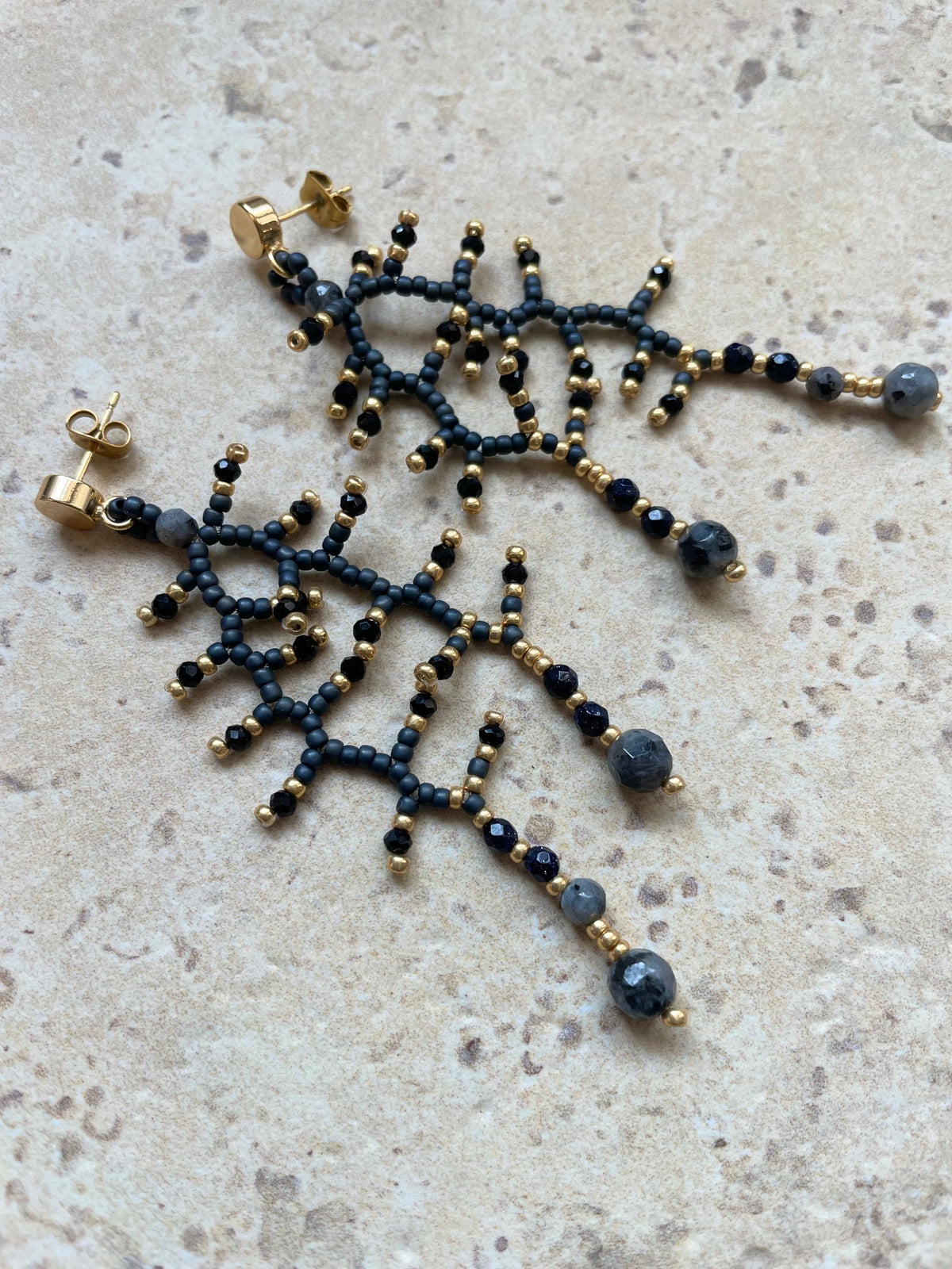 Metallic grey with gold and labradorit