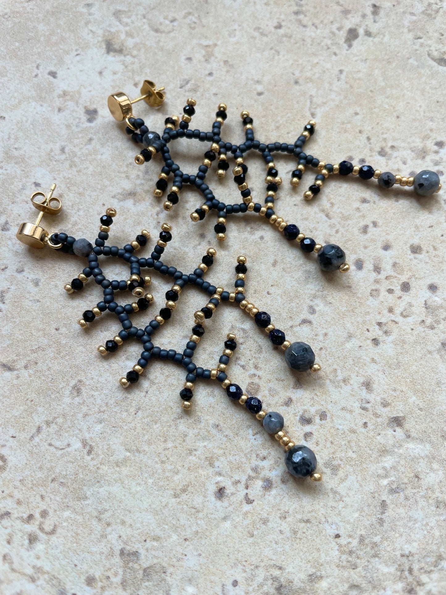 Metallic grey with gold and labradorit